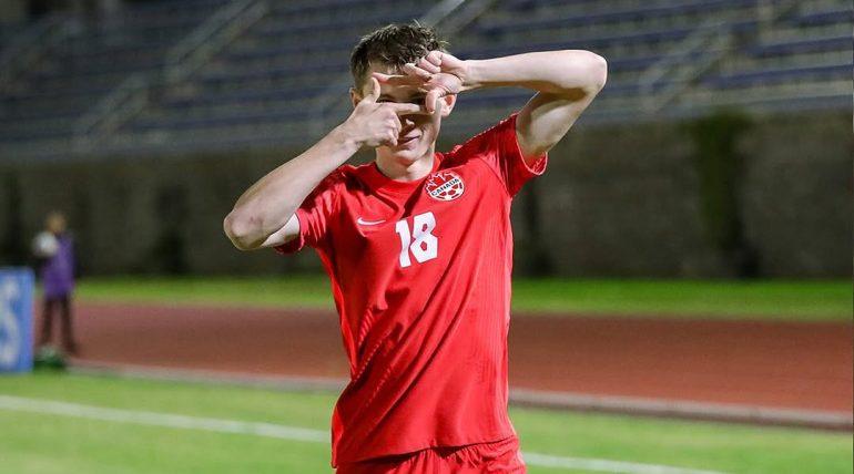 Player in a Canada shirt celebrating on the pitch