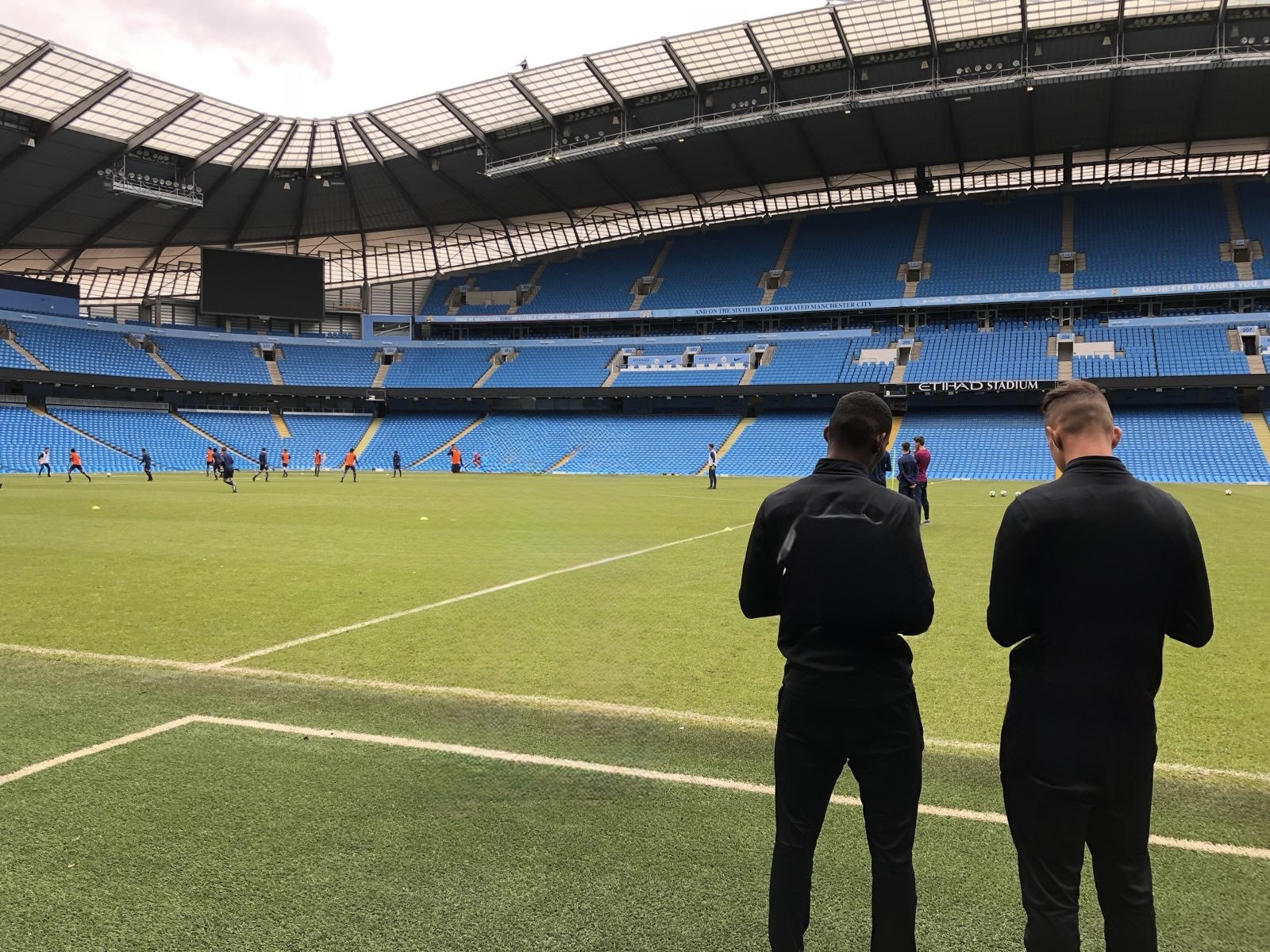 Players training on the pitch at the Etihad Stadium