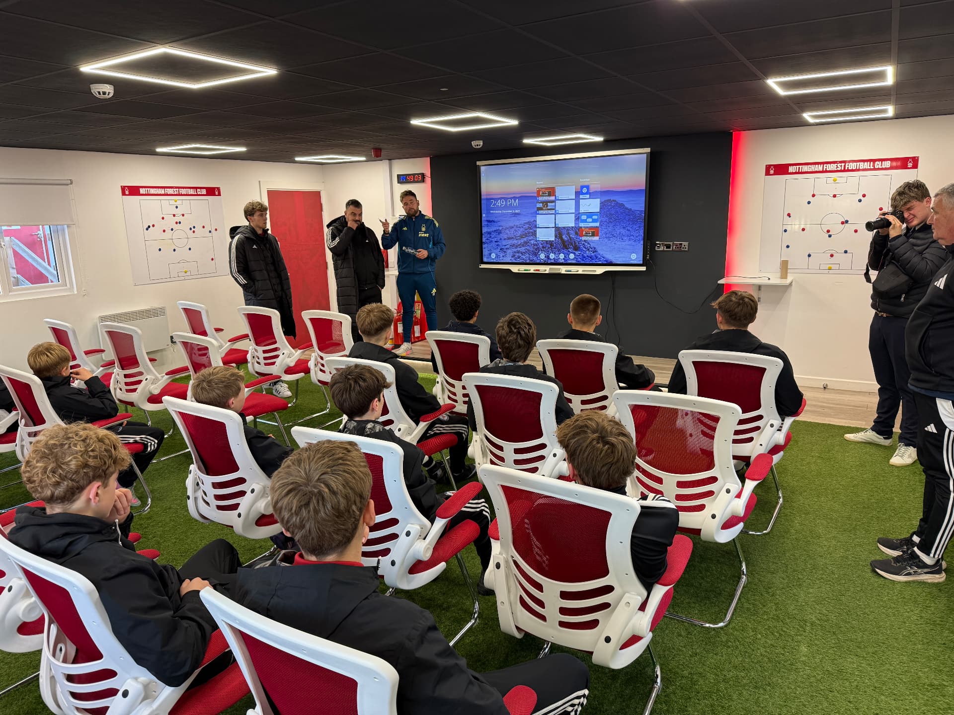 Academy Insider players and families attending a football development presentation