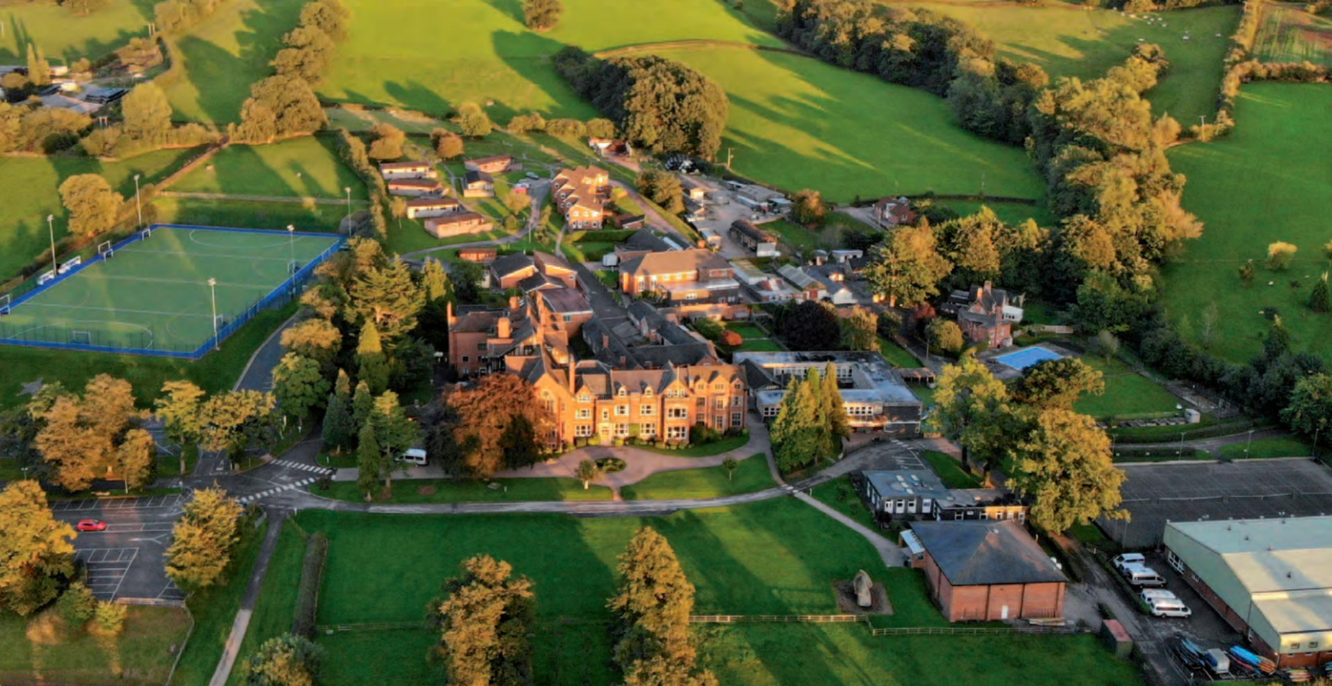 Aerial view of a UK independent school campus with sports pitches